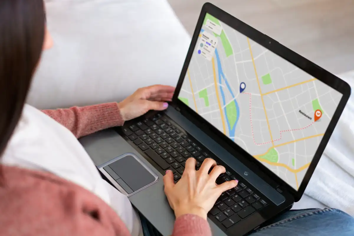 high-angle-woman-holding-laptop (1)